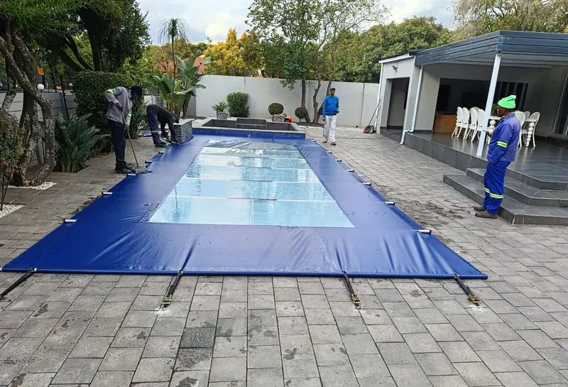 The team finishing a navy cover with clear panels
