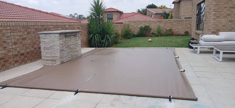 A brown PVC cover beside a brick bar counter